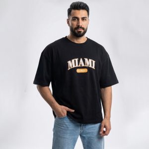 تیشرت یقه گرد مردانه باکسی مشکی دو نخ پنبه طرح دار مدل 49617